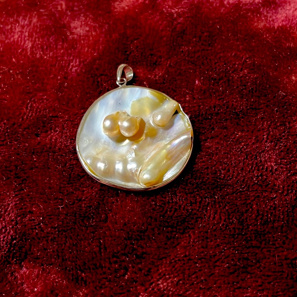 Mother of pearl round pendant .925 silver frame 1.5”